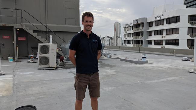 Adam Husband from Structural Diagnostics on the roof of the Breakers building in Broadbeach where the body corporate has paid for waterproofing work to take place under his company's supervision. Picture: Keith Woods.