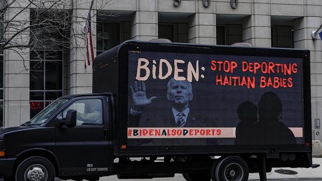 A. truck displaying messages expressing concern over the deportations of black immigrants drives past the office of US Immigration and Customs Enforcement (ICE). Picture: Getty Images.