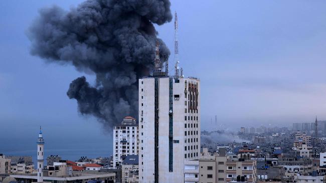 Smoke rise above buildings during an Israeli air strike, in Gaza City. Picture: AFP