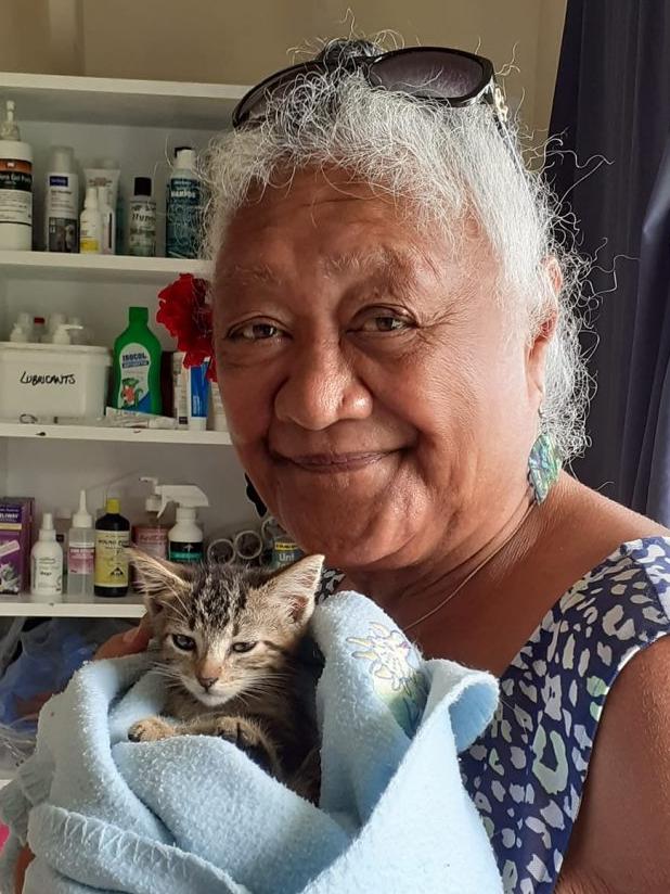 A woman cuddles a kitten at Te Are Manu vet clinic in the Cook Islands. Picture: Vets Beyond Borders