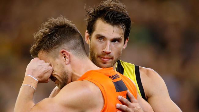 Alex Rance consoles former teammate Brett Deledio after the preliminary final. Picture: Getty Images