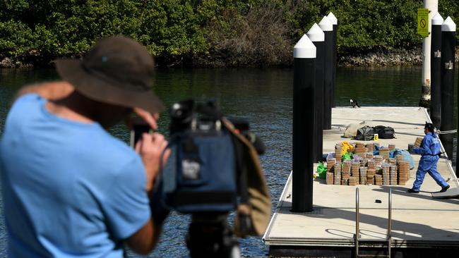 Police remove a large amount of methamphetamine from the yacht docked at Balmain. Picture: AAP