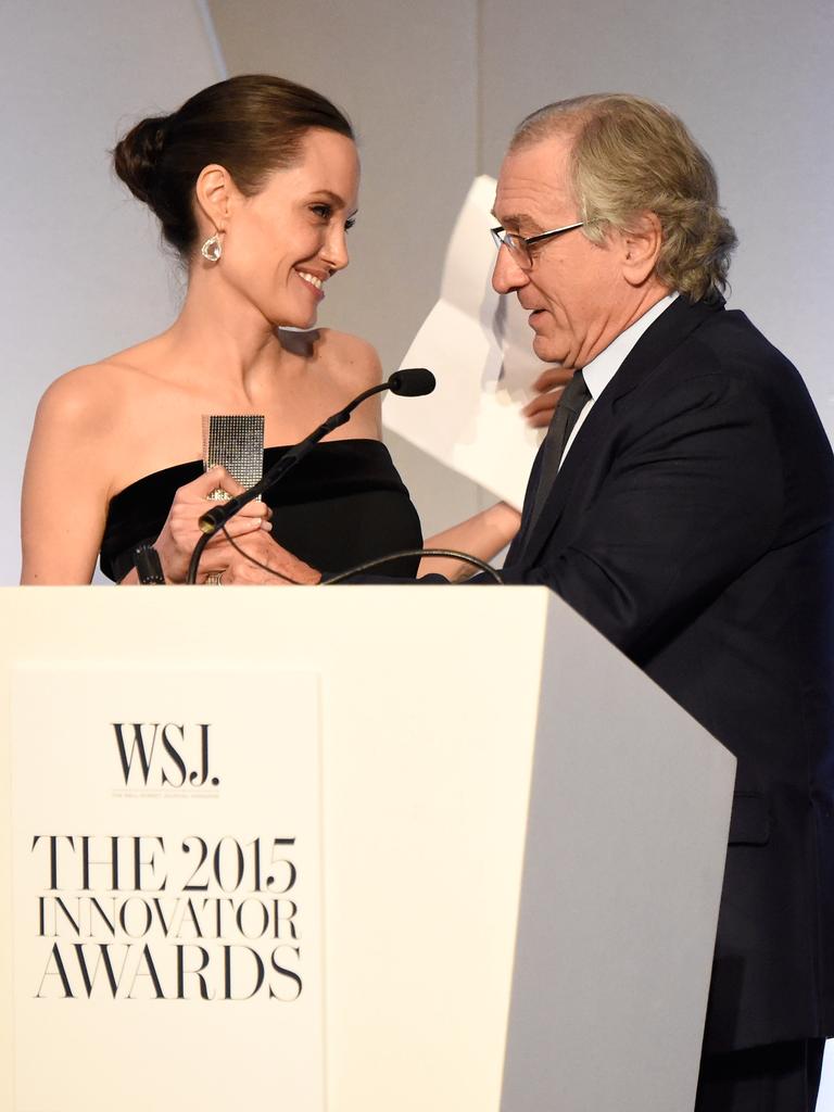 Angelina Jolie-Pitt accepts award from Robert DeNiro onstage at the WSJ. Magazine 2015 Innovator Awards at the Museum of Modern Art on November 4, 2015 in New York City. Picture: Getty