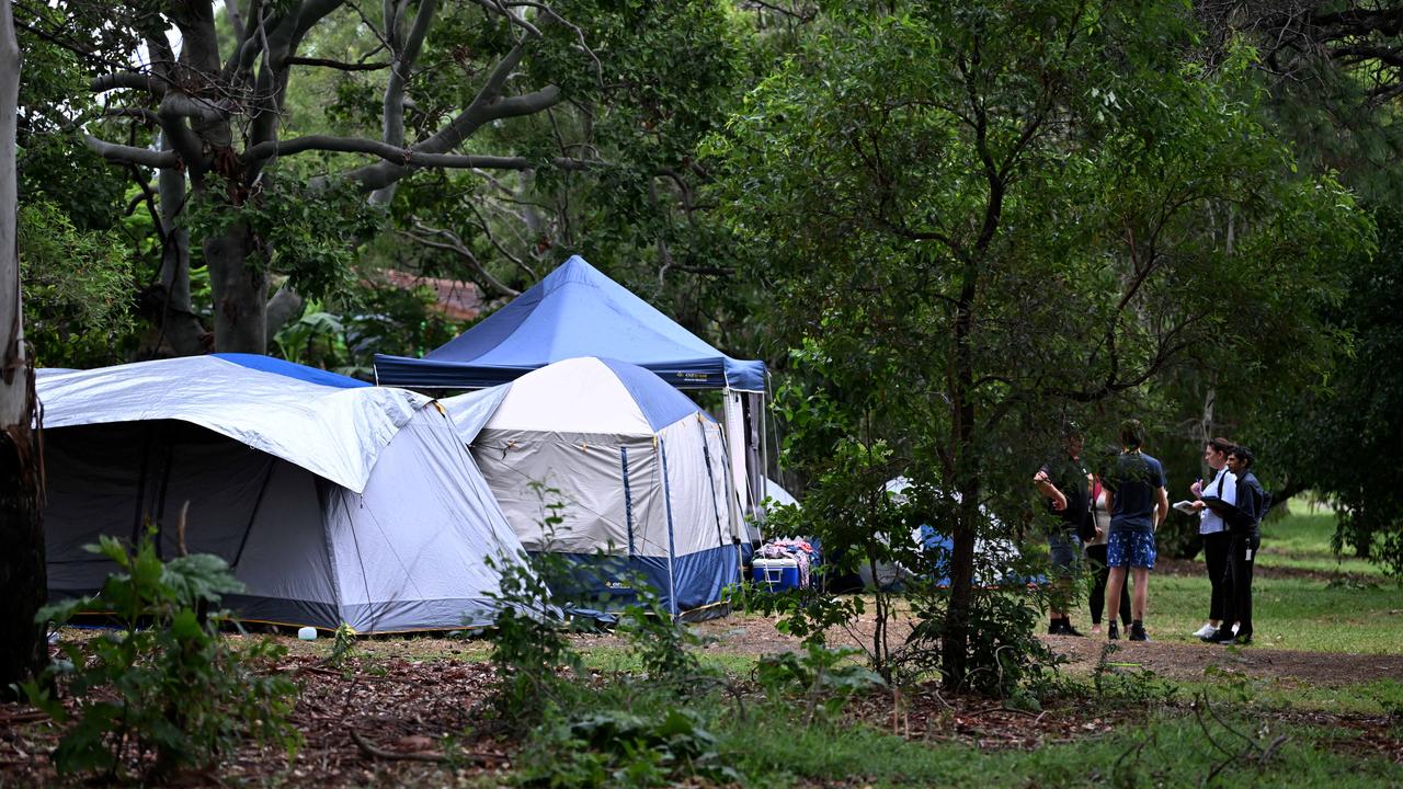 Department of Housing staff speak to tent city residents who have revealed their frustration in trying to raise their issues of not being able to secure accommodation with the state government. Picture: Dan Peled / NCA NewsWire