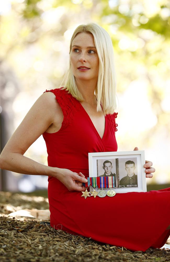 We won’t forget ... Georgi Glover with pictures of her great-uncles Fred and Cecil Glover, who died at Sandakan and in the Death March acroos Borneo during WWII. Picture: Sam Ruttyn