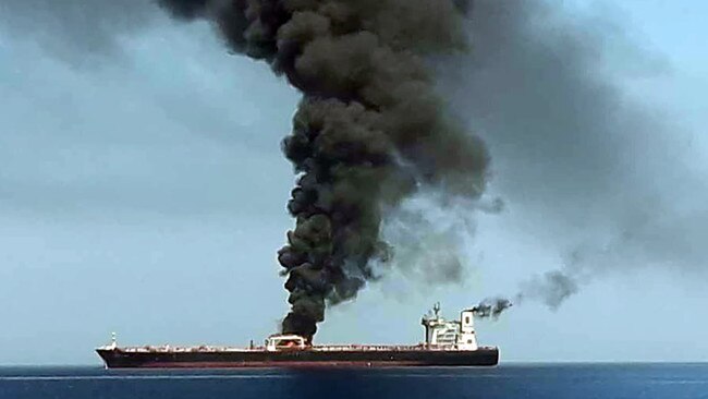 Smoke billows from a tanker after it was attacked off the coast of Oman. Picture: AFP