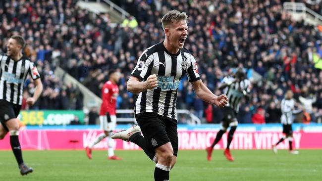 Matt Ritchie of Newcastle United celebrates after scoring against Manchester United.