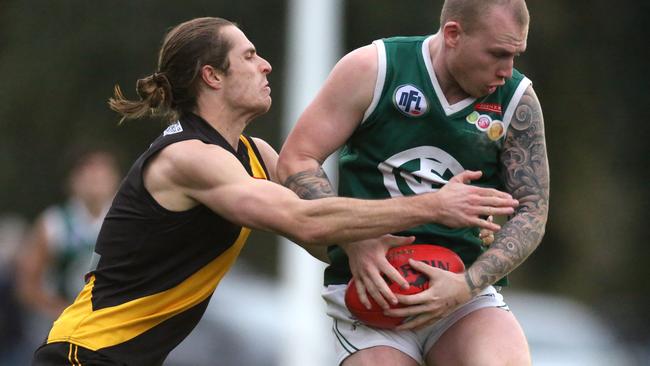 Treloar (left) in action for Heidelberg . Picture: Stuart Milligan