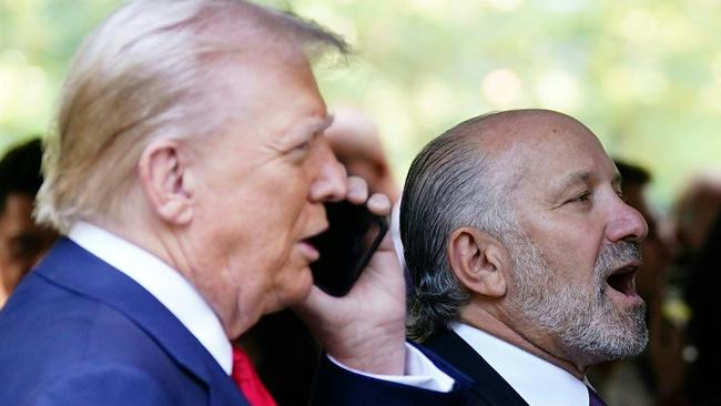 Howard Lutnick with Donald Trump at a remembrance ceremony on the 23rd anniversary of the September 11 terror attack on the World Trade Centre. Picture: AFP.