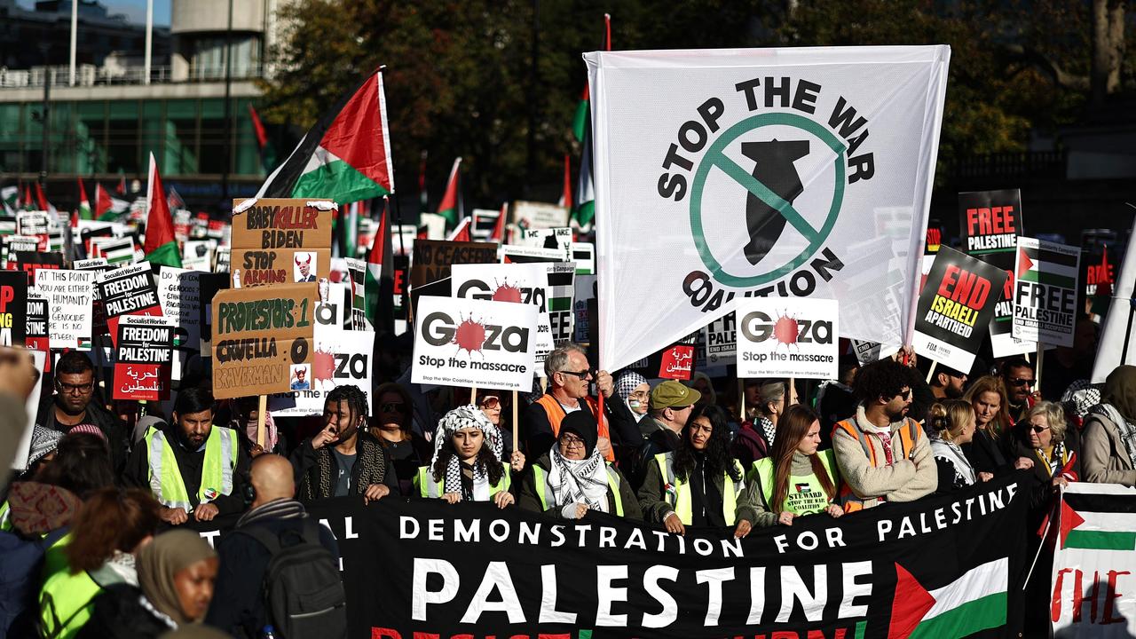 Protesters gathered with placards and flags calling for a ceasefire. Picture: Henry Nicholls/AFP