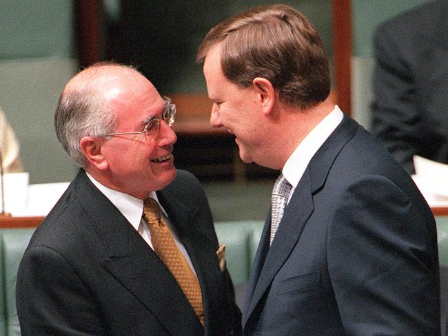 Mr Howard with Mr Costello after the treasurer delivered the 2000 federal budget in May. Picture: Michael Jones