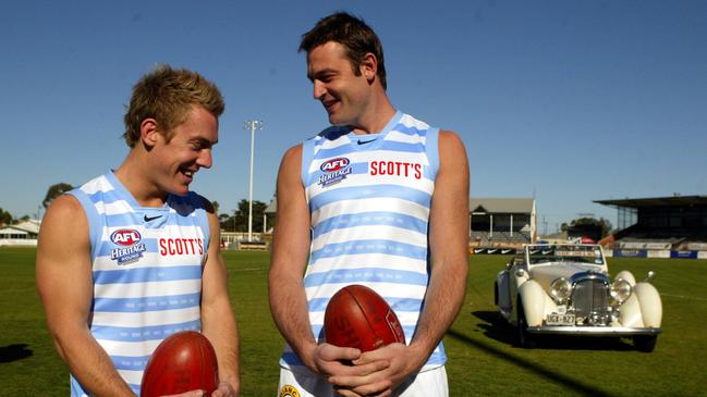 Brett Ebert with Matthew Primus wearing Port Adelaide heritage round guernseys in 2005.