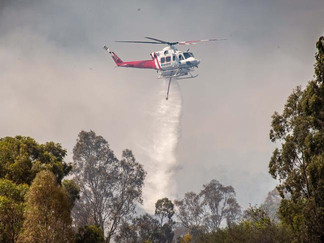 A small bushfire with 16 appliances including a water bomber just north of Broadford along the Hume Highway with Kilmore CFA attending and police blocking local roads. Picture: Jason Edwards Picture: Jason Edwards