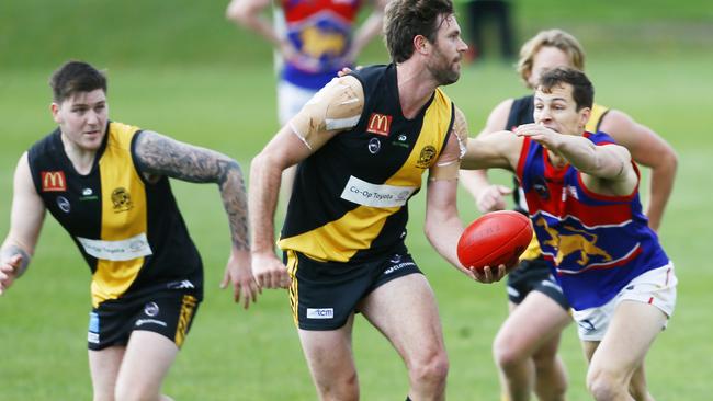 SFL. Hobart V Huonville at TCA Ground, Domain, Hobart. (L-R) Tom Etchell of Tigers looks to pass the ball. PICTURE: MATT THOMPSON