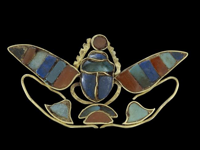 Ornament of a winged scarab holding a sun-disc. (about 880-1874 BC). Picture: The Trustees of the British Museum