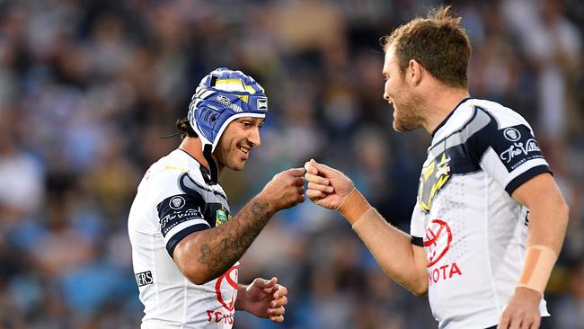 GOLD COAST, AUSTRALIA — SEPTEMBER 01: Johnathan Thurston of the Cowboys greets teammate Gavin Cooper before the round 25 NRL match between the Gold Coast Titans and the North Queensland Cowboys at Cbus Super Stadium on September 1, 2018 in Gold Coast, Australia. (Photo by Bradley Kanaris/Getty Images)