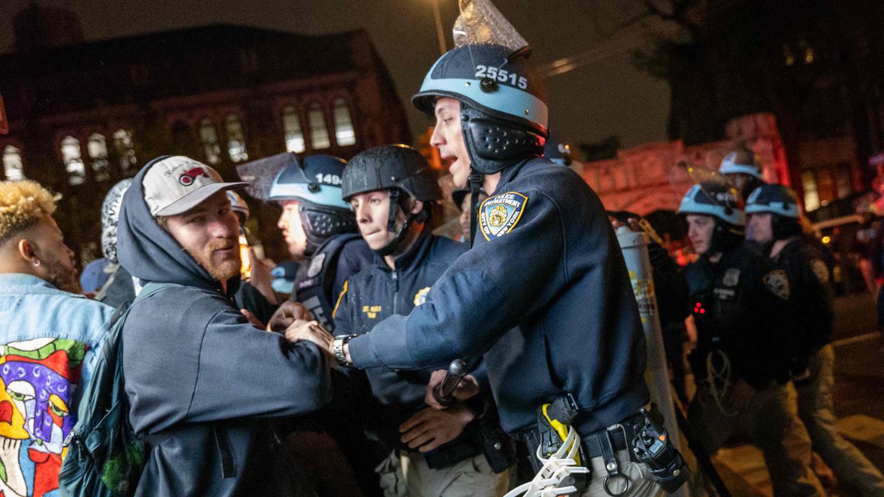 Pro-Palestinian supporters confront police during demonstrations at The City College Of New York. (Photo: Spencer Platt/Getty Images)