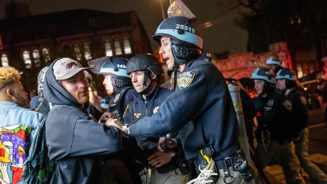 Pro-Palestinian supporters confront police during demonstrations at The City College Of New York. (Photo: Spencer Platt/Getty Images)