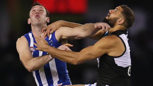 AFL Round 22. 17/08/2019. North Melbourne v Port Adelaide at Marvel Stadium .  Todd Goldstein of the Kangaroos and Paddy Ryder of the Power centre bounce contest   . Pic: Michael Klein