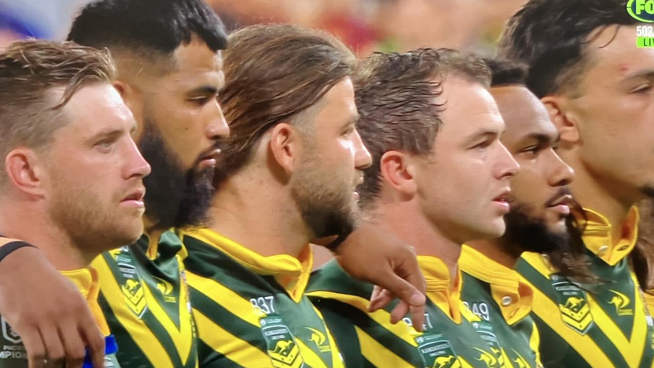 ‘Stunned mullets’: Australian players including Payne Haas (second left) during the anthem. Picture: Fox League