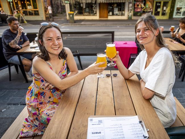 Annie James and Isabella Eiszele enjoy a beer at Beermash on Smith St. Picture: Jake Nowakowski