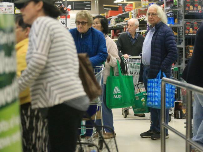 People attend Woolworths Glenhuntly early in the morning after the announcement of a dedicated hour for the elderly and people with a disability in the community. Picture: Mark Stewart