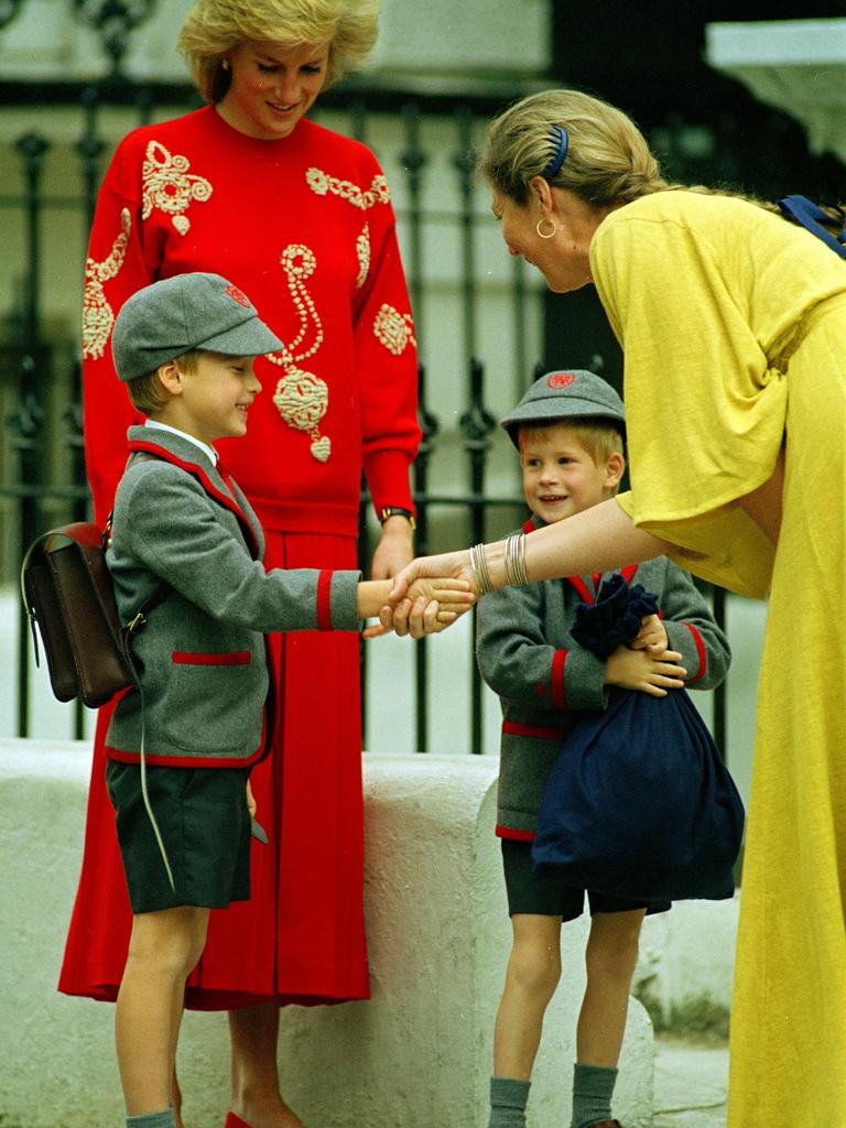 Prince William gets a handshake on Harry’s first day of school. (AP Photo/Gill Allen)