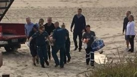 A man has been pulled from the water after falling off his surfboard at Mermaid Beach. Photo: 7 News Gold Coast