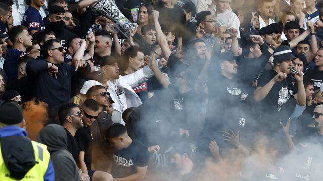 Fans set off flares in the AAMI Park stands. Picture: Getty