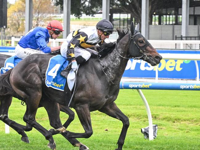 Here To Shock (NZ) ridden by Daniel Stackhouse wins the Sportsbet Victoria Handicap at Caulfield Racecourse on April 06, 2024 in Caulfield, Australia. (Photo by Reg Ryan/Racing Photos via Getty Images)