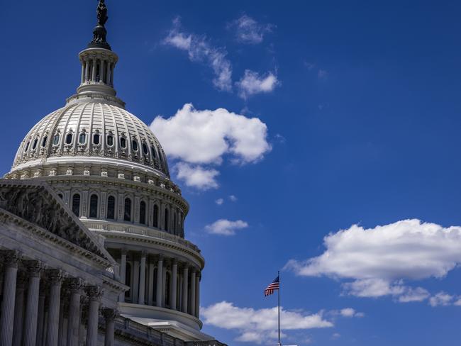 WASHINGTON, DC - JUNE 16: The American flag flies above the U.S. Capitol building during a press conference on Capitol Hill with lawmakers and members of The American Legion on June 16, 2021 in Washington, DC. Lawmakers on Capitol Hill are working with groups like The American Legion to push for the Biden Administration to approve the evacuation of Afghans who assisted American forces during the war in Afghanistan before the September 11th troop withdrawal deadline.   Samuel Corum/Getty Images/AFP == FOR NEWSPAPERS, INTERNET, TELCOS & TELEVISION USE ONLY ==