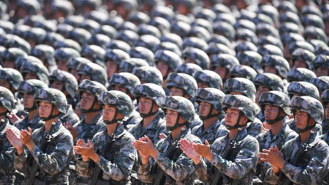 Chinese soldiers applaud their leader during the parade. Picture: AFP