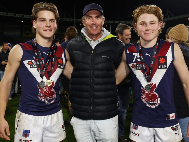 Will Ashcroft with father Marcus (middle) and brother Levi (right) after Sandringham’s premiership in 2022. Picture: Daniel Pockett/Getty Images