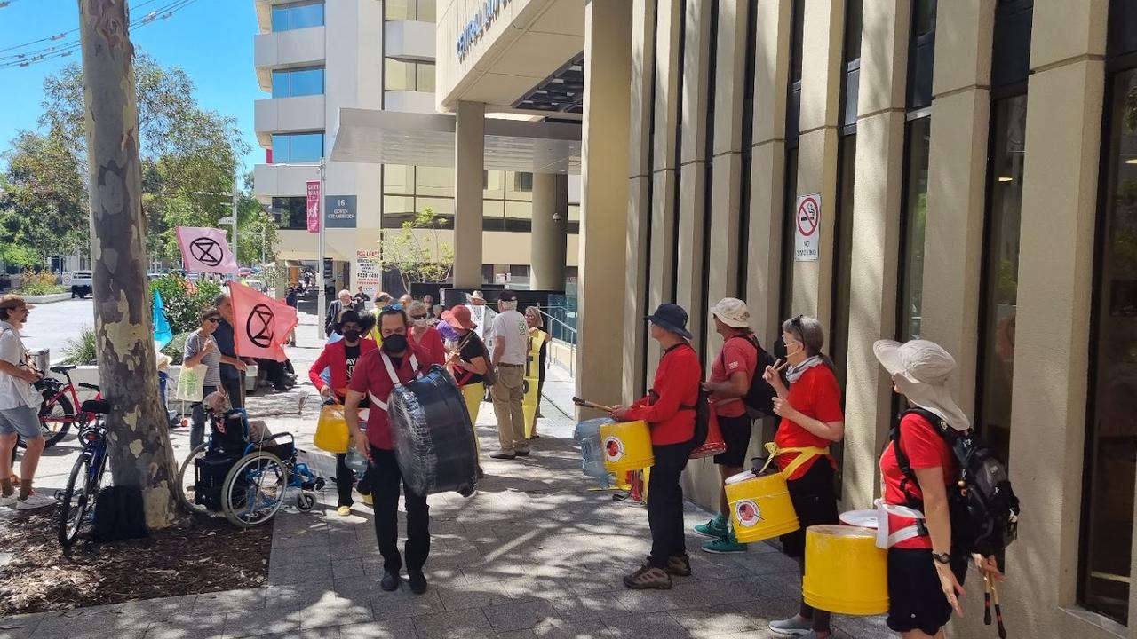 About 30 protesters, including drummers, parked themselves outside Perth’s Central Law Courts on Tuesday. Picture: NCA NewsWire / Anthony Anderson