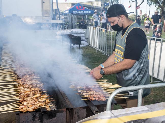 Enrico Lupiba from Hoy Pinoy tends the grill at Meatstock, Toowoomba Showgrounds. Friday, April 8, 2022. Picture: Nev Madsen.