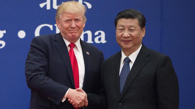 Then US president Donald Trump and China's President Xi Jinping shake hands on November 8, 2017. Picture: AFP