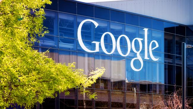 Mountain View, USA - March 4, 2015: Google headquarters logo on Mountain view California glass office building on a late Winter morning. Wide horizontal panoramic image.