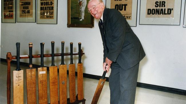 Australian former Test cricketer Sir Donald Bradman at the opening of an exhibition of Bradman cricket memorabilia at the State Library of South Australia, 24 Nov 1992. Posing with the bat he used to score 334 runs against England in the 1930 Leeds Test.