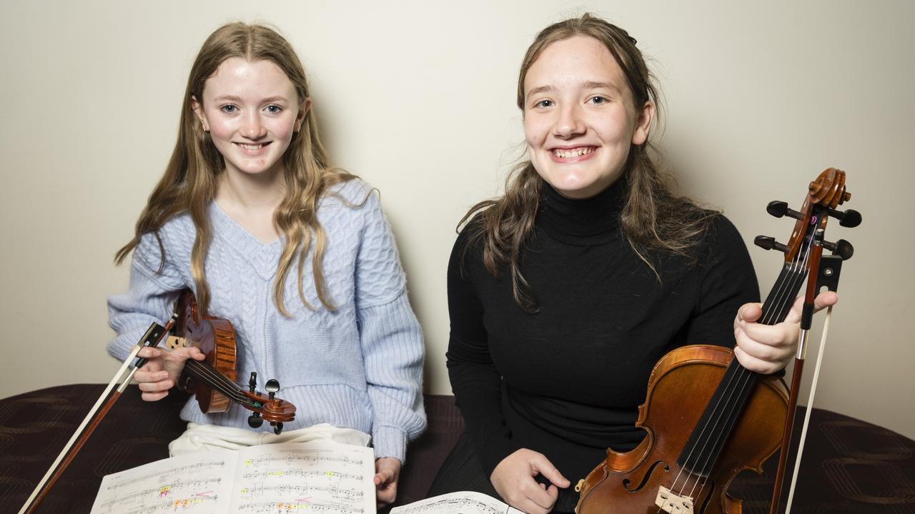 Eva Young (left) and Elise Sack before competing in solo string sections of the 77th City of Toowoomba Eisteddfod at Empire Theatre. Picture: Kevin Farmer