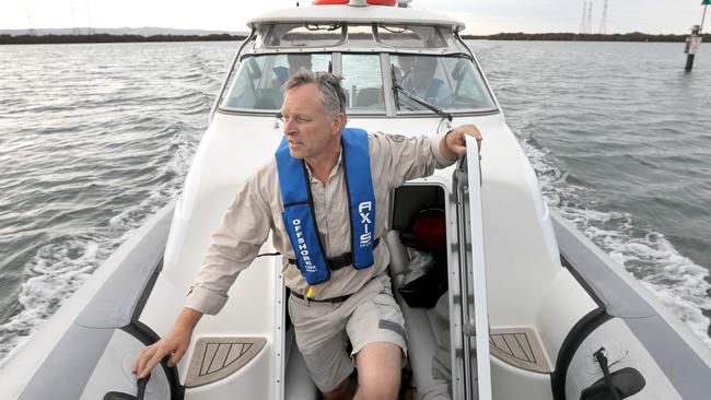 Marine Park ranger, Jon Emmett on a boat trip on the Port River around Garden Island looking out for dolphins. Picture: Dean Martin