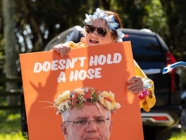 A small group of Hawaii-themed protesters met Mr Morrison outside the cannery. Picture: Jason Edwards