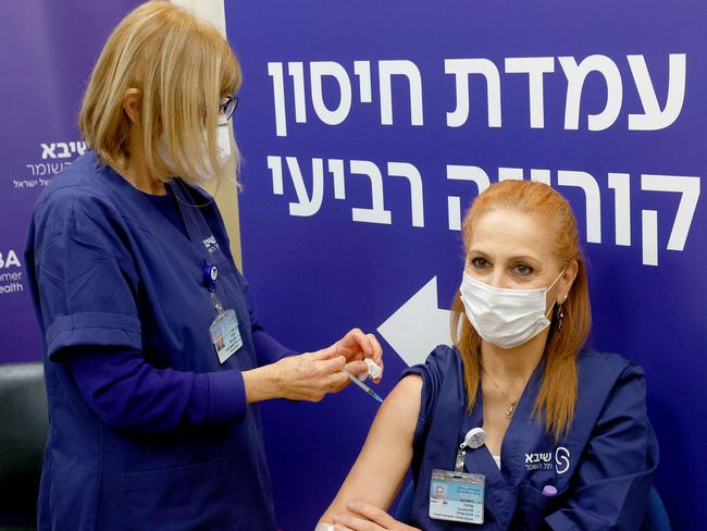 An Israeli nurse a fourth dose of the Pfizer-BioNTech coronavirus vaccine at the Sheba Medical Centre as hospital conducted a trial of the vaccine's fourth jab on staff volunteers. Picture: AFP