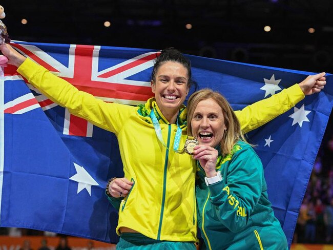 BIRMINGHAM, ENGLAND - AUGUST 07: Ash Brazill (L) of Team Australia with Assistant Coach Nicole Richardson (R) celebrate after winning the Final match between Jamaica and Australia on day ten of the Birmingham 2022 Commonwealth Games at NEC Arena on August 7, 2022 on the Birmingham, United Kingdom. (Photo Sue McKay/Getty Images)