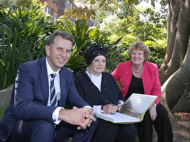 Transport Minister Andrew Constance and North Shore MP Jillian Skinner join Wendy Whiteley in the secret garden for the announcement. Picture: Adam Ward