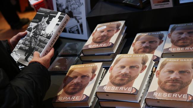 A customer looks at copies of Prince Harry’s memoir in Berlin. Picture: Getty