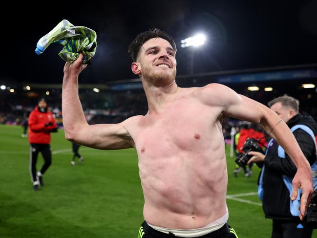 Gunners’ Declan Rice throws his match shirt into the crowd after his stoppage time goal against Luton Town. Picture: Julian Finney/Getty Images.