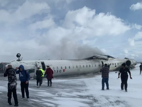 A Delta Air Lines flight is upside down after crashing at Toronto airport. Picture: Supplied