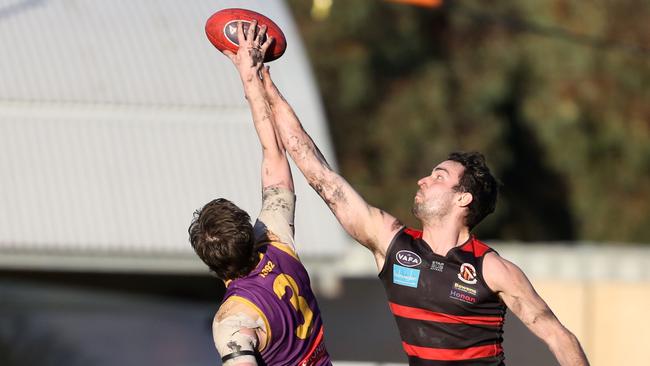 Collegians’ Matthew Singleton in the ruck against Xavier Richards for Old Xaverians.Picture: Stuart Milligan