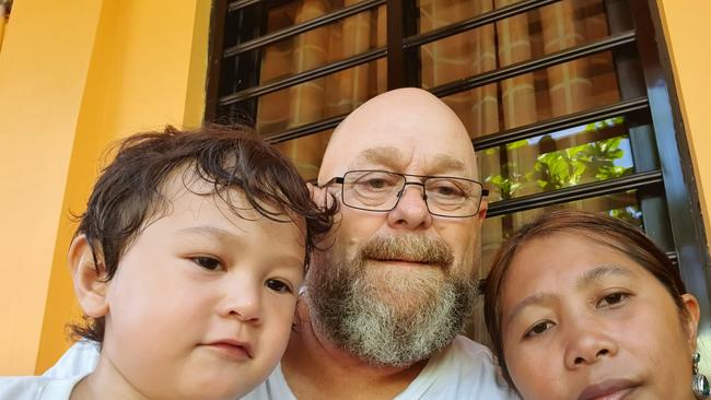 Hobart man Brett Riseley with wife Imelda and three-year-old son Tasman. They are stuck in the Philippines and unable to return to Tasmania because of coronavirus restrictions.