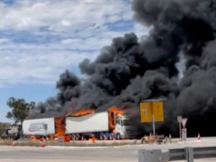 Chaos has erupted on the West Australia border after four trucks were engulfed by flames.